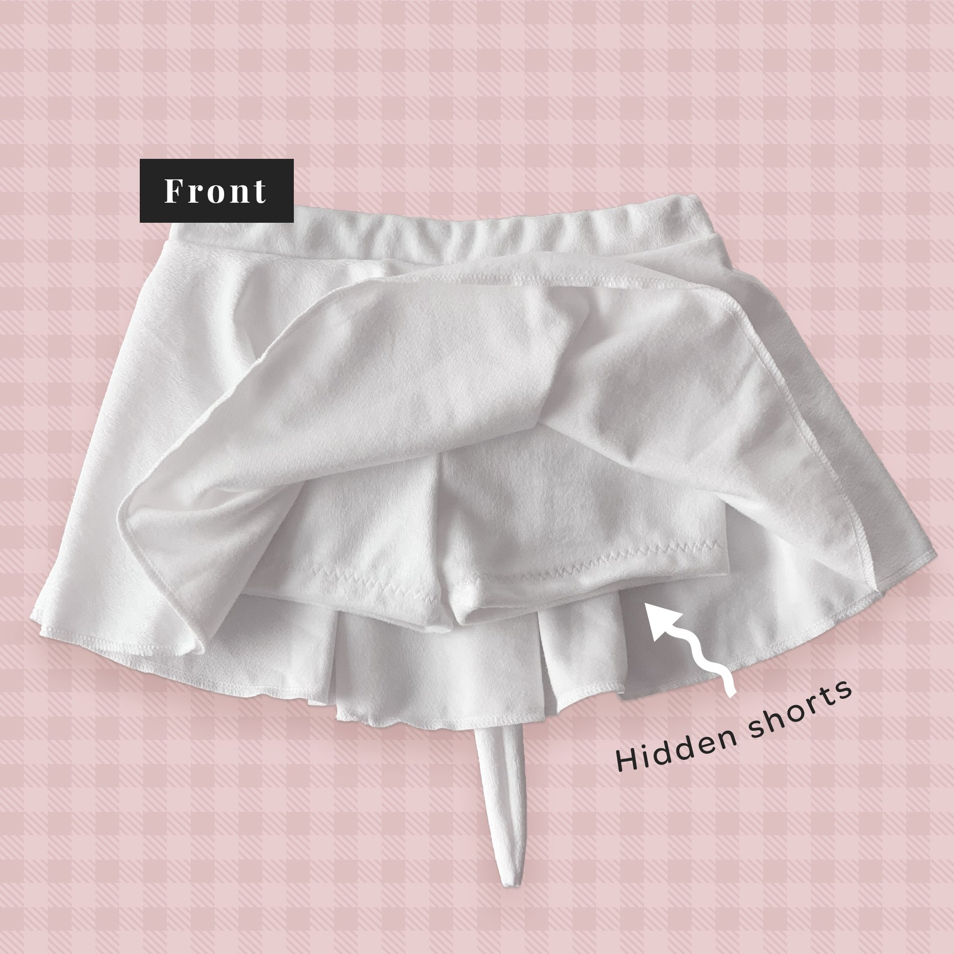 White skirt with hidden shorts on a pink checkered background